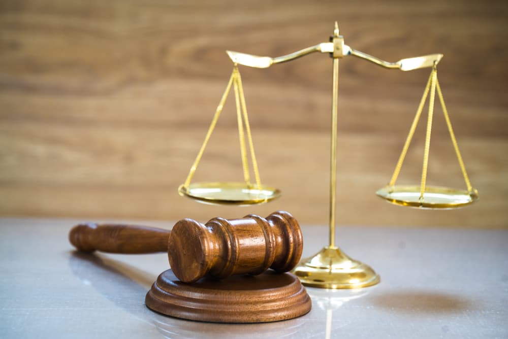 Judge’s gavel and scales of justice symbolizing legal services, court decisions, and law. Judge’s gavel and scales of justice symbolizing legal services, court decisions, and law.