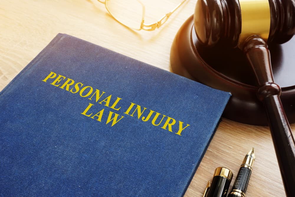 Personal injury law book and gravel Personal injury law book and gravel