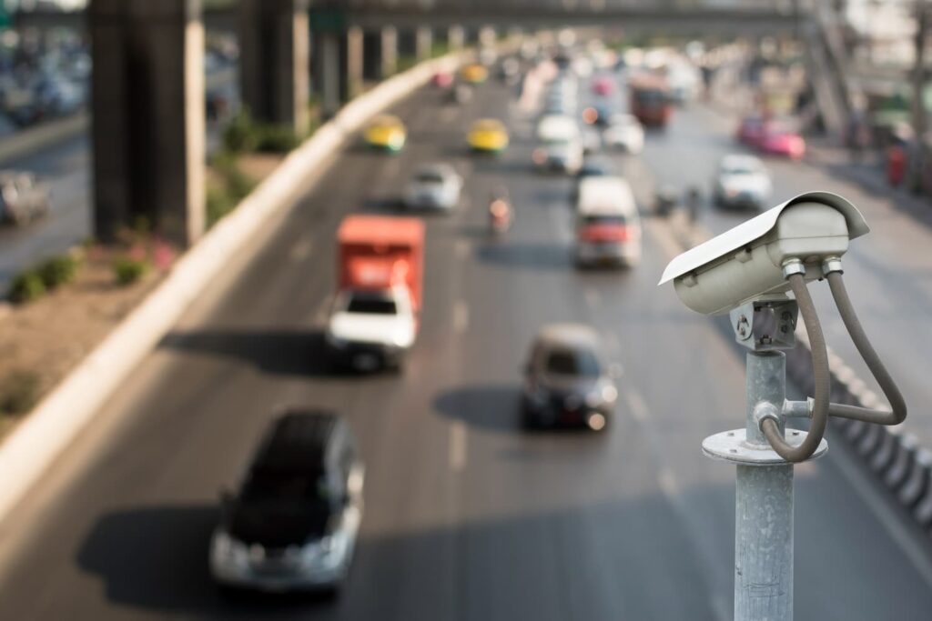 Road Traffic Surveillance Camera View Traffic surveillance camera monitoring vehicles on a busy road