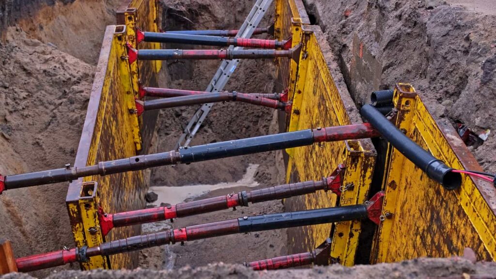 Trench Collapse Safety Measures On Long Island Construction Sites With Proper Shoring System Trench shoring system in Long Island excavation site preventing trench collapse accidents and ensuring worker safety